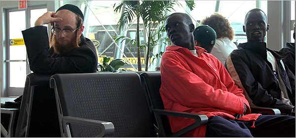 Two of the Sudanese refugees (Panther Bior, center, and Daniel Abul Pach, right) on their way to Pittsburgh
Photo: Newmarket/National Geographic Films
