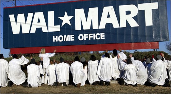 The Church of Stop Shopping Gospel Choir and Reverend Billy 
perform an exorcism at Wal Mart�s Bentonville, AR, headquarters
Photo: Fred Askew